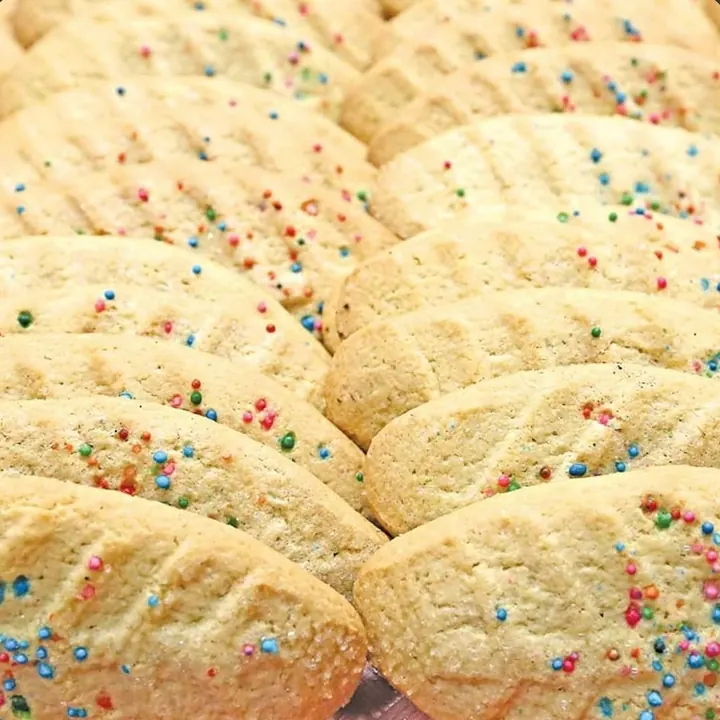 Rows of sweet bread cookies with colored sprinkles