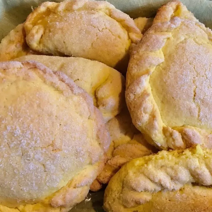 Golden pastelitos de piña, pineapple-filled turnovers