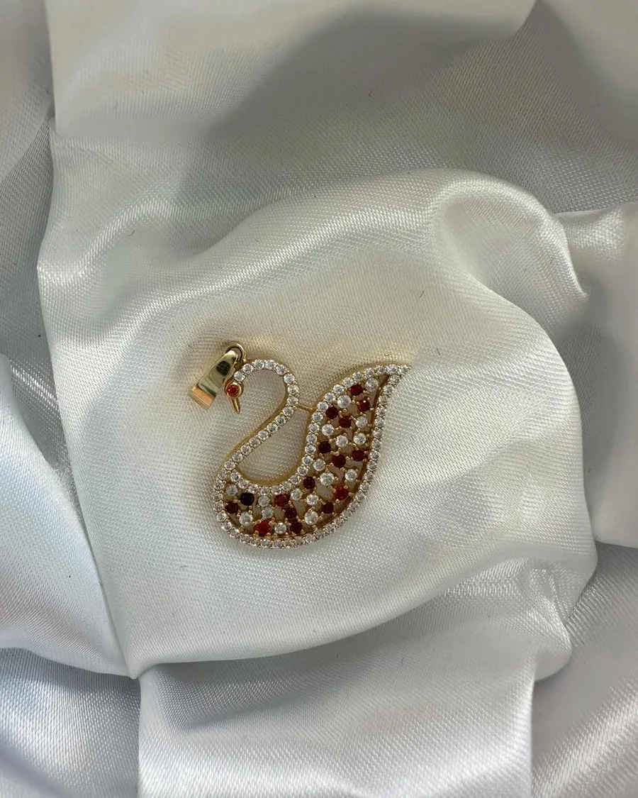 Gold swan pendant set with red and white stones