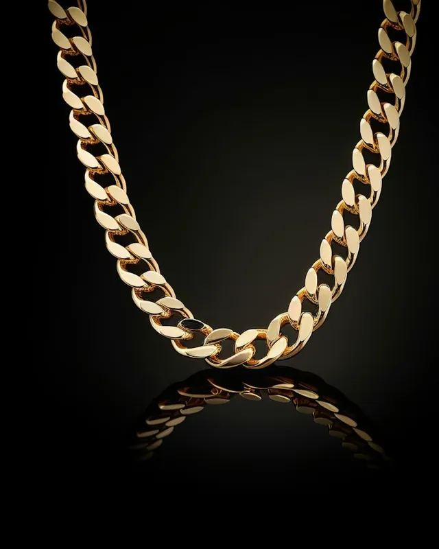 Gold Cuban link chain on a black background